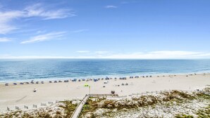 A beach with a sandy shore, a clear blue sky, and a calm sea. - New to the Rental Market, Newly Owner, Newly Renovated!!! (Orange Beach)
