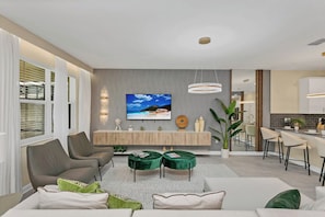 Our Living Area Flows Effortlessly into the Dining Space, Creating a Welcoming Atmosphere for Shared Moments and Memorable Meals. With Comfortable Seating and Elegant Décor, It's Where Comfort Meets Style. - Incredible 9BR! Private Pool+Theme Rooms+Game Room (Kissimmee)