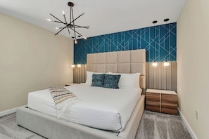 Inviting bedroom of the home in Kissimmee Florida - Intricately designed wall details - Immerse in luxury with chic furnishings, setting the tone for sophistication - Cozy double bed and elegant lighting fixtures - Incredible 9BR! Private Pool+Theme Rooms+Game Room (Kissimmee)
