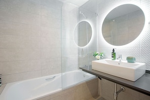 Bathtub, hair dryer, towels