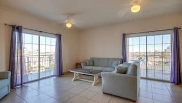 Deluxe Condo | Living area | 42-inch flat-screen TV with cable channels, LCD TV