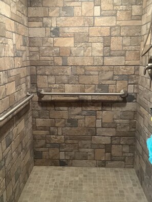 Shower, hair dryer, towels, toilet paper