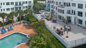 A hotel with a rooftop pool, outdoor seating areas, and multiple balconies. - Sublime Sunsets at the Truman Annex in Key West (Key West)