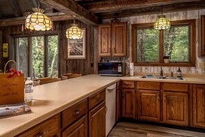 Fridge, microwave, oven, stovetop - Rustic, cozy log home vacation retreat near Sister Bay. (Ellison Bay)