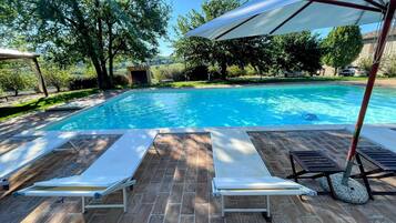 Outdoor pool, pool umbrellas, pool loungers