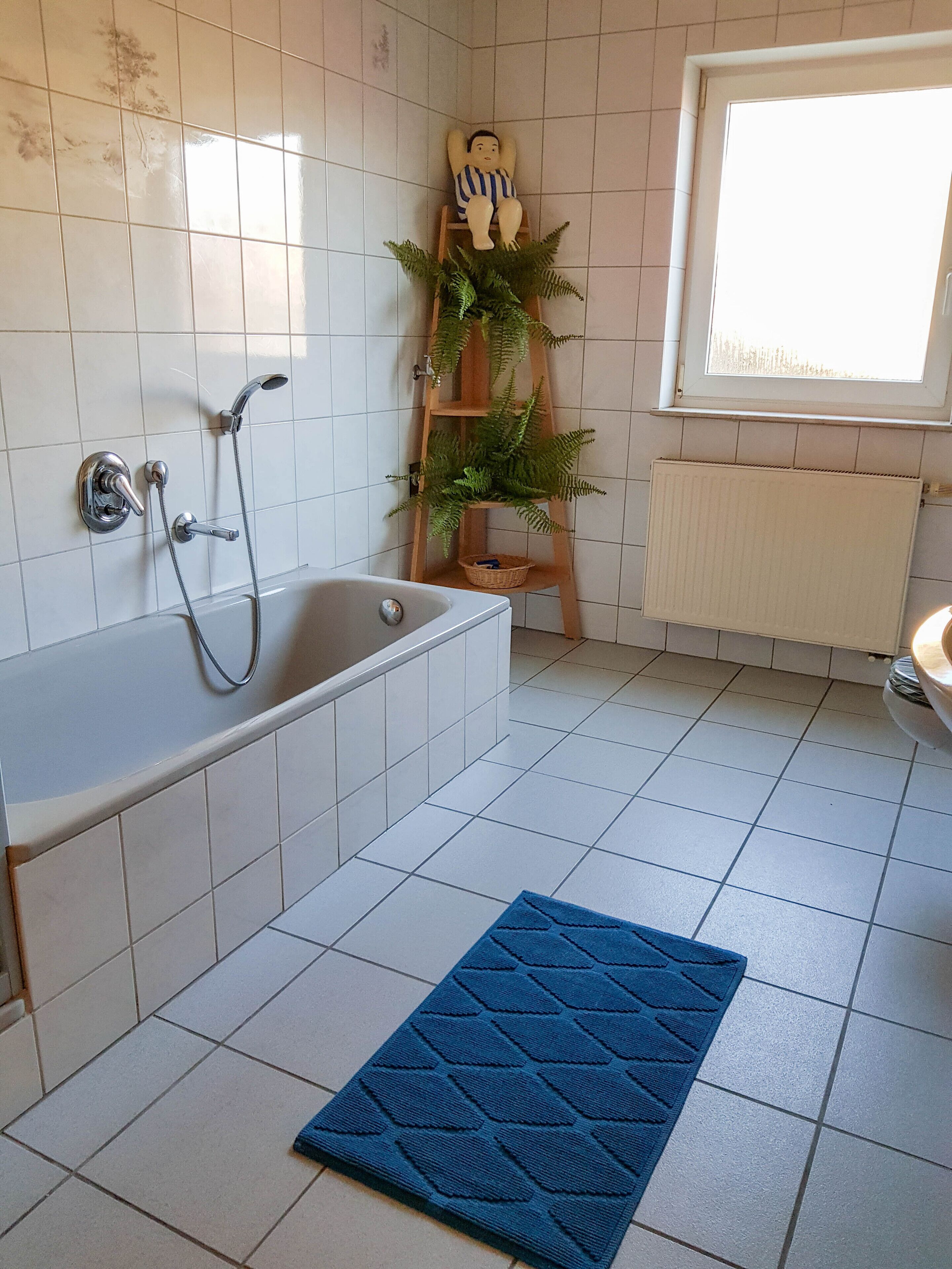 Bathtub, hair dryer, towels, soap
