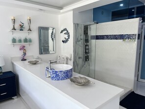 Shower, hair dryer, towels, soap
