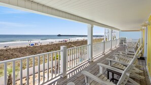 A covered outdoor area with a view of the beach and pier. - 2 Night Minimum Stay in Off Season - Pet Friendly 8BR Oceanfront Home in Cherry Grove, Game Room & Beautiful Pool (ISLELAG) (North Myrtle Beach)