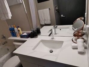 Bathtub, hair dryer, towels, soap