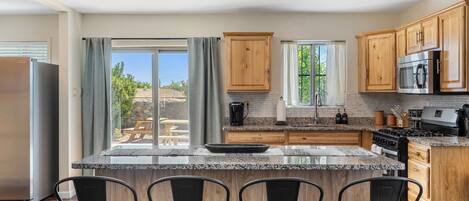 Fridge, coffee/tea maker, cookware/dishes/utensils