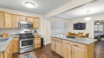 Fridge, coffee/tea maker, cookware/dishes/utensils