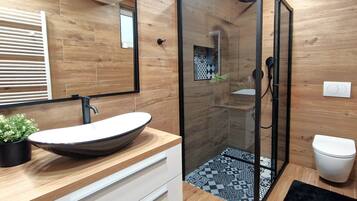 Bathtub, hair dryer, towels, soap