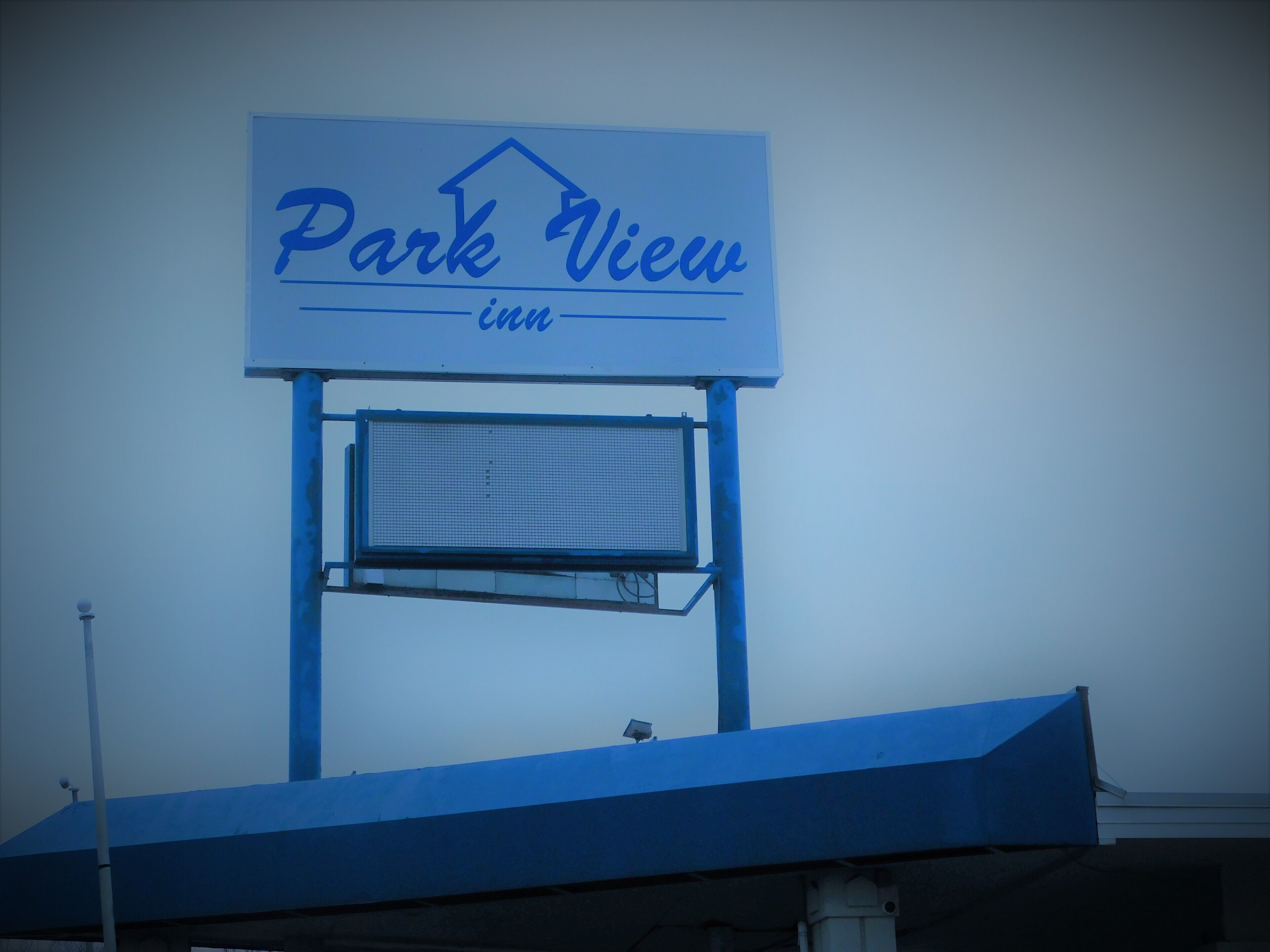 A sign for 'Park View Inn' with a simple, clear font and a house icon above the text.