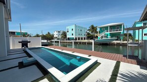 Outdoor pool, a heated pool - El Tesoro a Beautiful 3 Bedroom 2 Bath Marathon Home w/ Private Pool & Dock (Marathon)