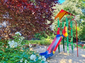 A playground with a slide and climbing structures. - Sienkiewicz Residence (RS2.21) - RS2.21 (Swinoujscie)