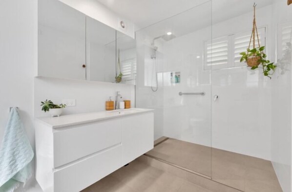 Shower, hair dryer, towels, soap
