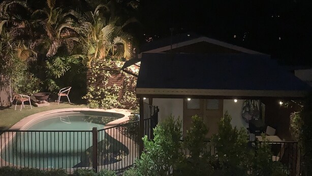 A residential area with a swimming pool, a covered patio, and surrounding greenery. - Boudoir on Bryce St - (Pet Friendly to ONE, SMALL non hair shedding dog 4.5kg) (Moffat Beach)