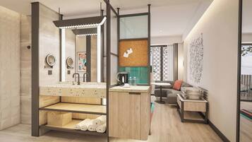 A modern bathroom with a freestanding shower, a vanity with a mirror, and a small seating area with a table and cushions.