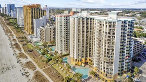 A high-rise hotel with multiple balconies, a swimming pool, and a beachside location. - Wow-Fabulous Oceanfront 15th floor 2 Balconies! (Myrtle Beach)
