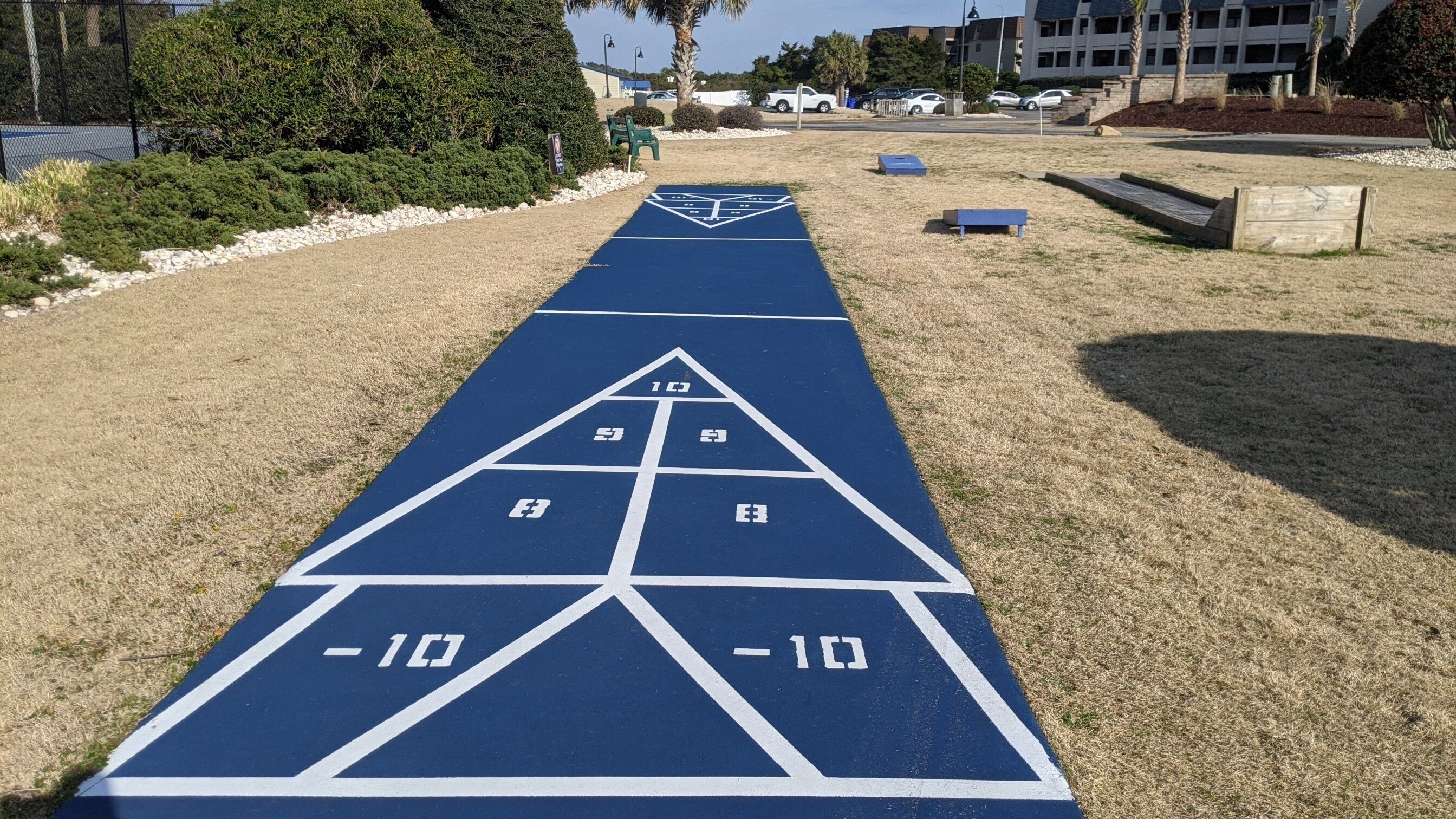 A shuffleboard court with numbered scoring areas.