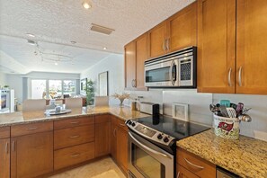 Fridge, microwave, oven, stovetop - Treasure Island Waterfront Condo on Peaceful Isle of Capri (Treasure Island)