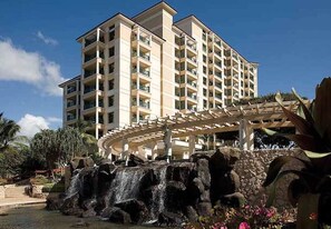 Experience the serene atmosphere of this hotel, surrounded by a landscaped area with a rock formation and a small waterfall.