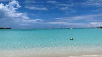 On the beach, sun loungers, beach towels