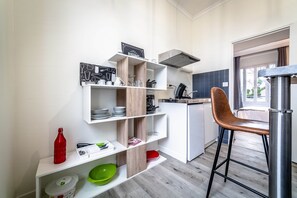 Fridge, microwave, coffee/tea maker, cookware/dishes/utensils