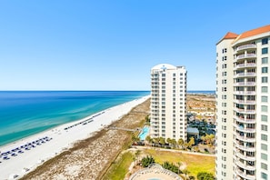 A beachfront hotel with a pool, beach access, and high-rise buildings. - Beach Colony East 14C- 3BD Gulf Front w/Beach Chair Service & Onsite Mgmt (Navarre Beach)