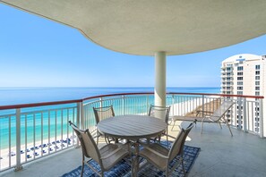 Outdoor dining - Beach Colony East 14C- 3BD Gulf Front w/Beach Chair Service & Onsite Mgmt (Navarre Beach)