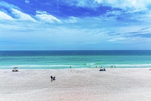 A beach with a clear sky and calm sea. - Sunset Beach 102: Gulf Front, Stunning Views, On the Beach, Pool by Anna Maria Life Vacation Rentals (Holmes Beach)