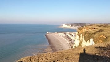 On the beach, sun-loungers, beach towels