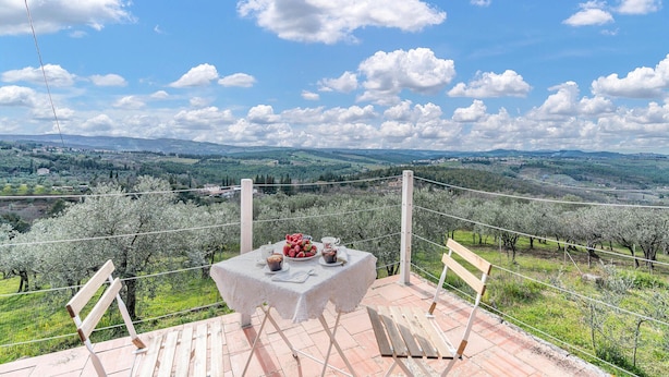 A table set outdoors with a view of a countryside landscape. - 3 bedroom gorgeous home in Greve in Chianti (Greve in Chianti)