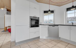 Fridge, stovetop, dishwasher, coffee/tea maker