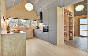 Fridge, stovetop, dishwasher, coffee/tea maker