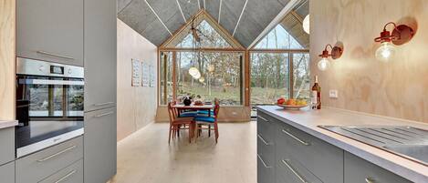 Fridge, stovetop, dishwasher, coffee/tea maker