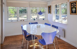 Sit around the round table with six chairs in this inviting space.
