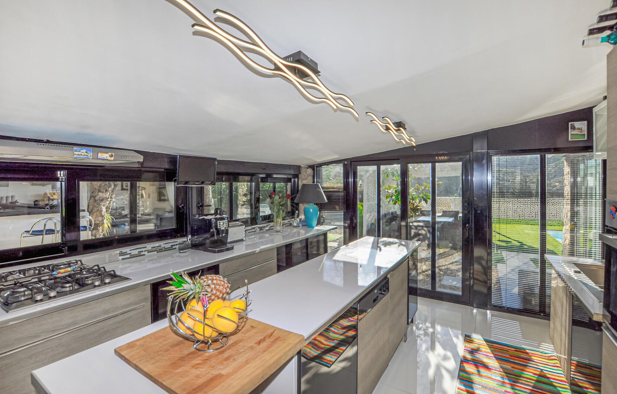 Fridge, stovetop, dishwasher, coffee/tea maker