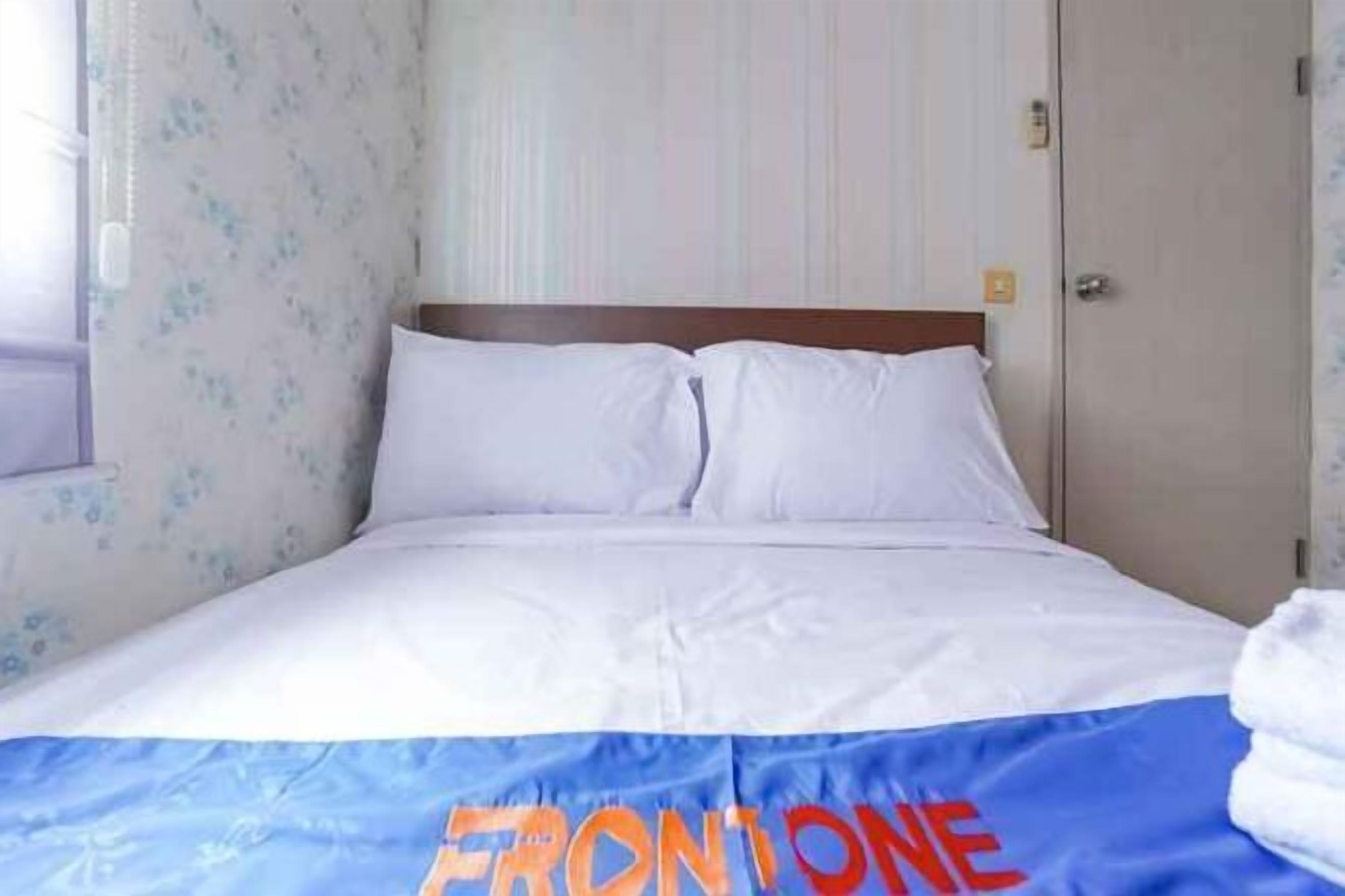 Premium bedding, desk, laptop workspace, soundproofing