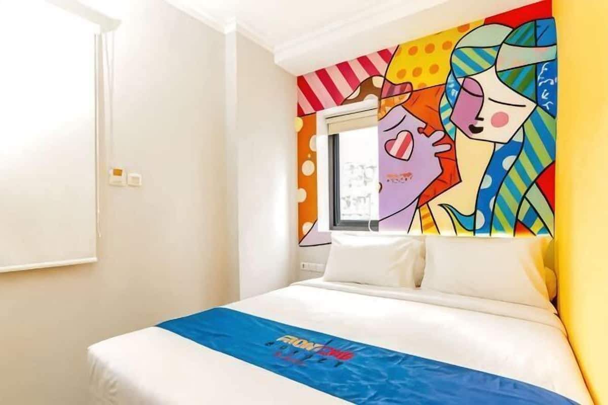 Premium bedding, desk, laptop workspace, soundproofing