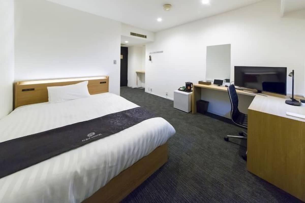 Down duvets, desk, laptop workspace, blackout curtains