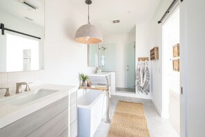 Bathtub, hair dryer, towels, soap