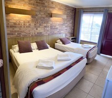 Twin Bed 2 People Room | Blackout drapes, iron/ironing board, free WiFi, bed sheets