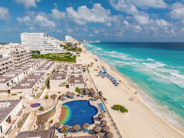 On the beach, sun loungers, beach towels