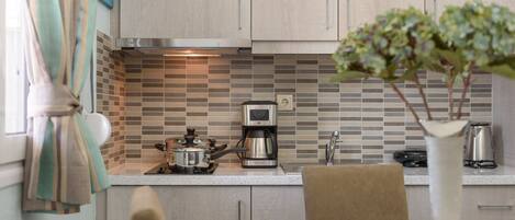 Fridge, coffee/tea maker, toaster, cookware/dishes/utensils