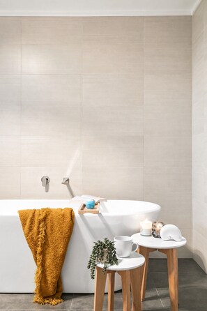 Bathtub, hair dryer, towels