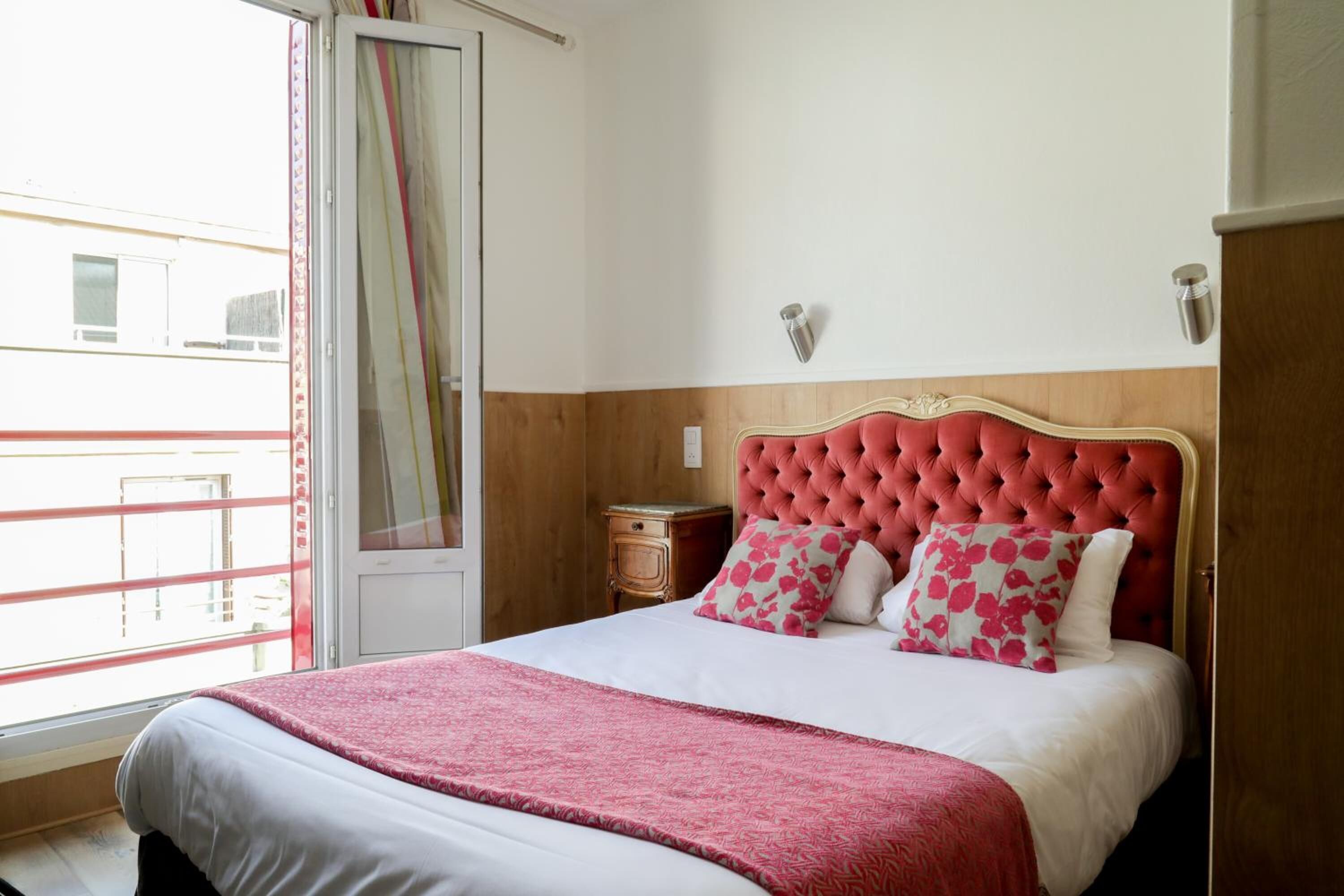 Premium bedding, desk, laptop workspace, blackout drapes
