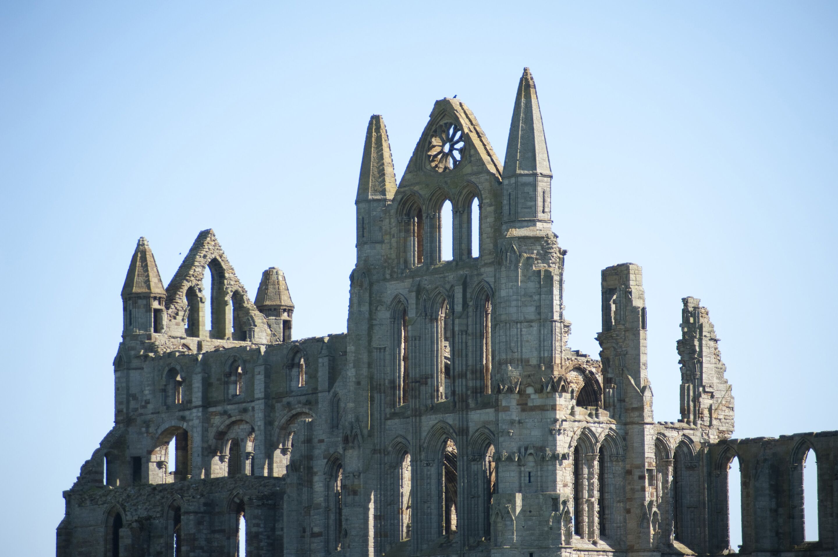 A historic cathedral with multiple spires and large windows.