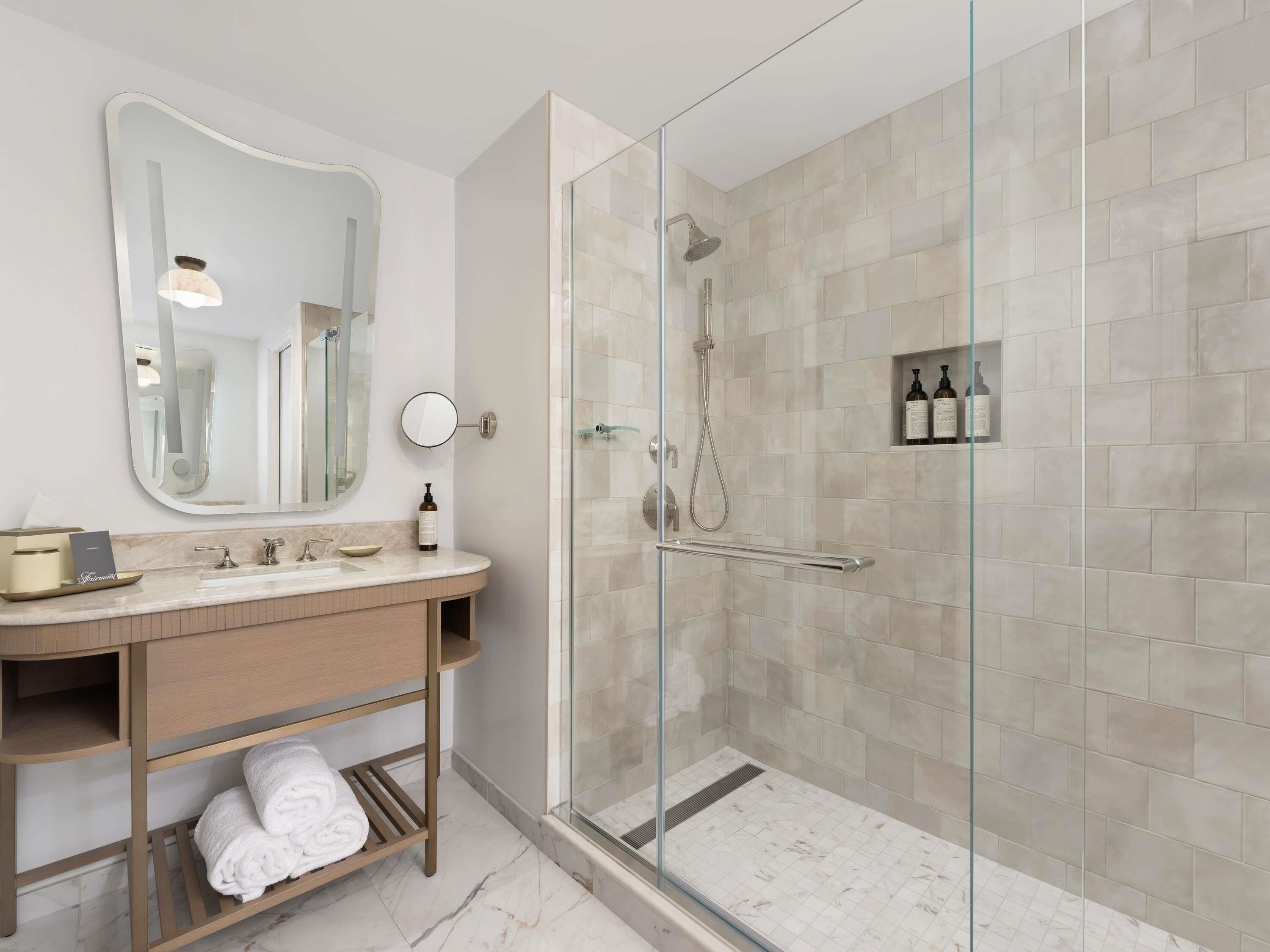 Separate bathtub and shower, designer toiletries, hair dryer, bathrobes