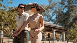 A couple standing outdoors with a building in the background. - Privado Villas at the Fairmont Scottsdale Princess (Scottsdale)